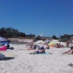 playa turistas calor