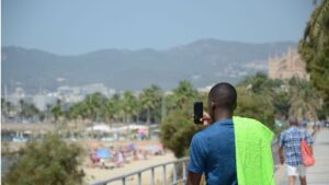 verano playa turista fotograf&iacute;a