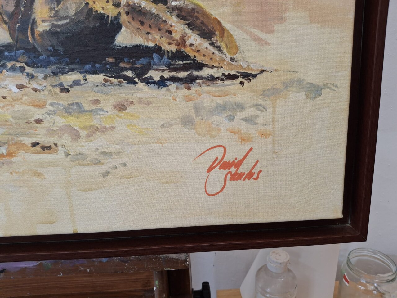 Firma del artista David Santos en un lienzo pintado