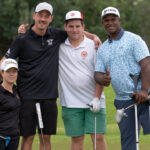 Cuatro golfistas posando en el campo durante el Handisport Mallorca Open 2025