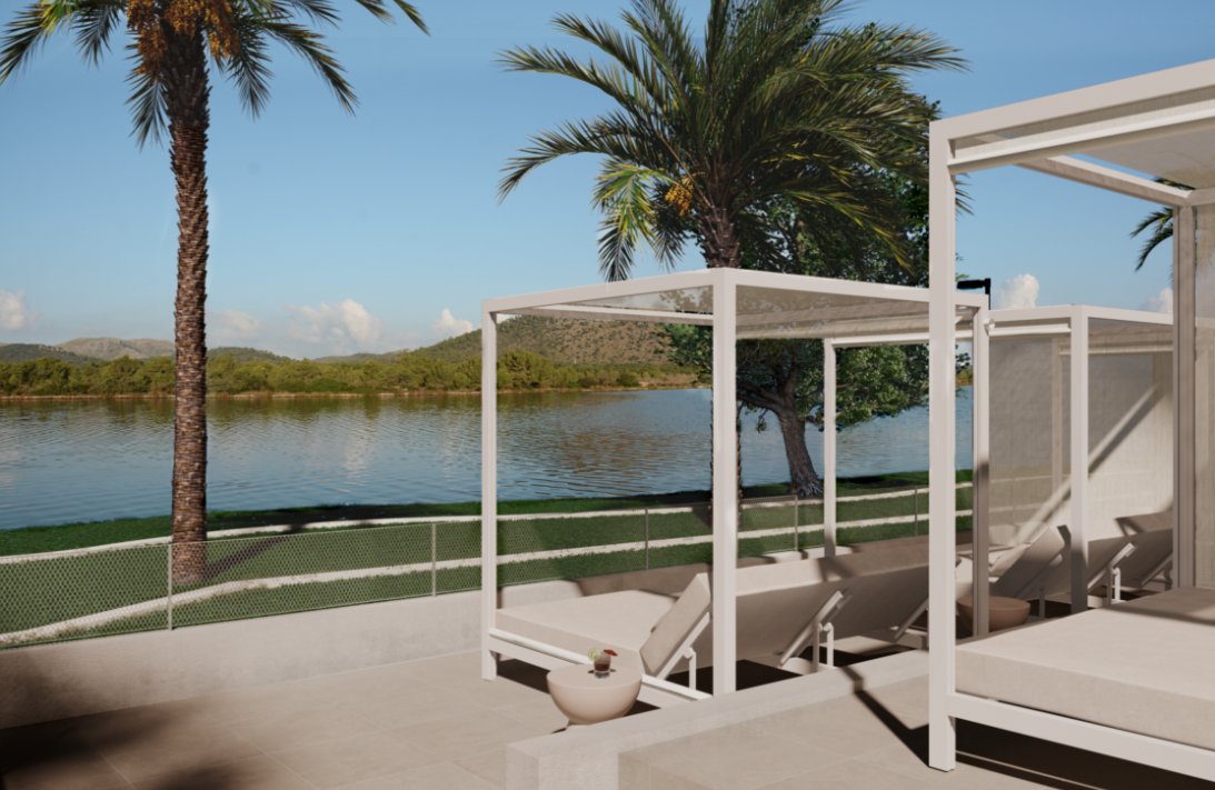 Vista del &aacute;rea de descanso junto al lago en el VIVA Eden Lago