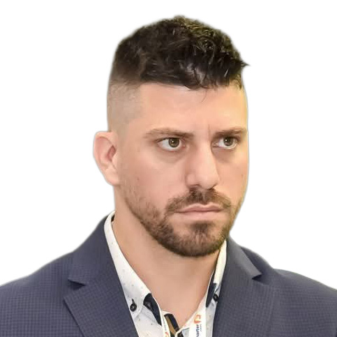 Retrato formal de un hombre con cabello corto y barba