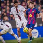 Jugadores del FC Barcelona y RCD Mallorca en un partido de f&uacute;tbol